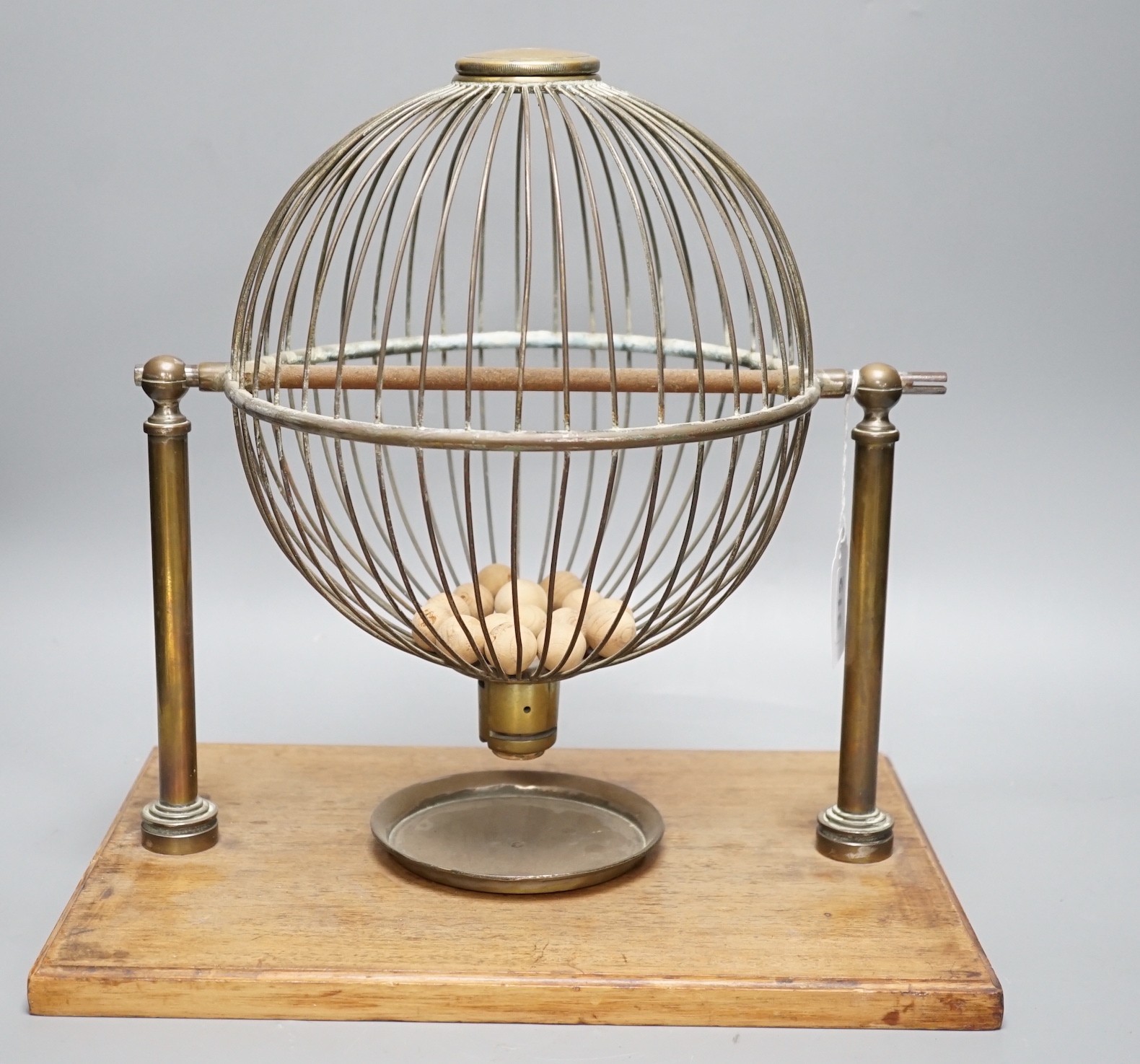 A mahogany and brass gaming tombola cage